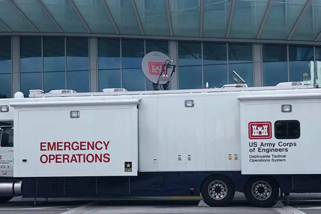 A mobile operations truck sits parked in from of the MBCC