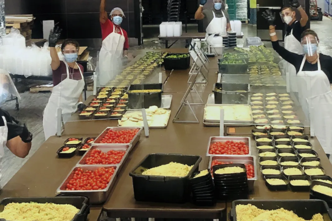 Chefs cooking in the Centerplate kitchen